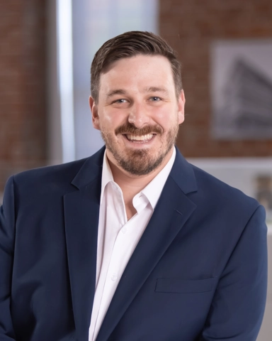 portrait of a smiling person in professional attire